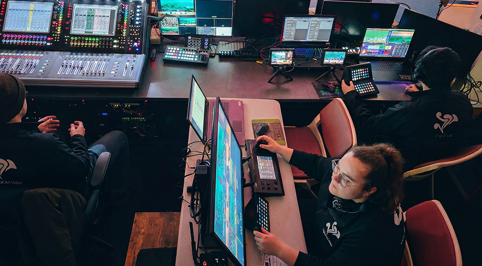 DAV Production crew operating video switching and audio consoles during a live event