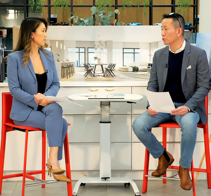 Two presenters discussing EB-5 investment opportunities during a hybrid seminar