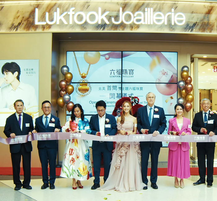 Guests cutting the ribbon at the LukFook Jewelry grand opening at Tangram