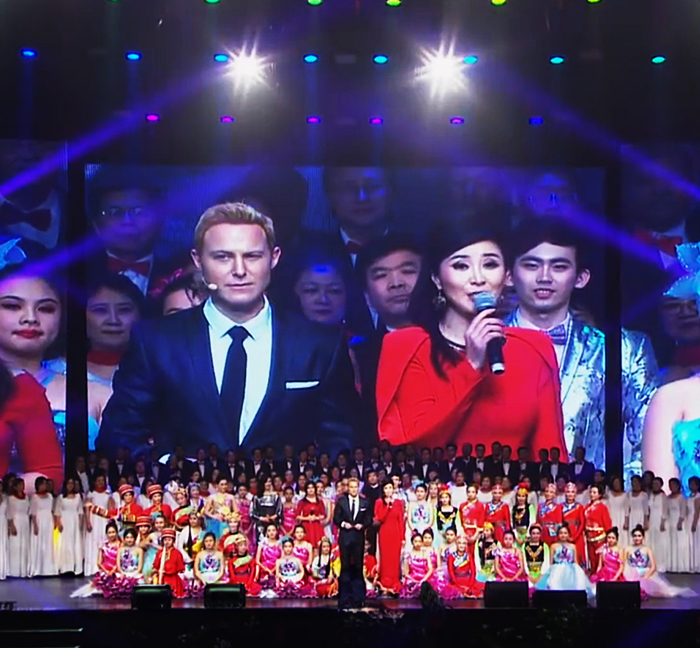 Large ensemble of hosts and cultural performers at the 2018 Lunar New Year Gala